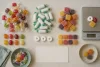 Unbranded wrapped hard candies and rolls arranged beside a blank count card and kitchen scale