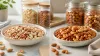 Raw-looking and roasted mixed nuts separated into two unbranded bowls with intact storage jars