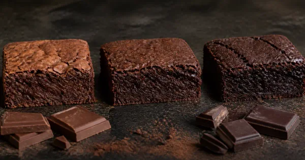 Three fudgy brownie squares made with progressively darker chocolate Three fudgy brownie squares made with progressively darker chocolate